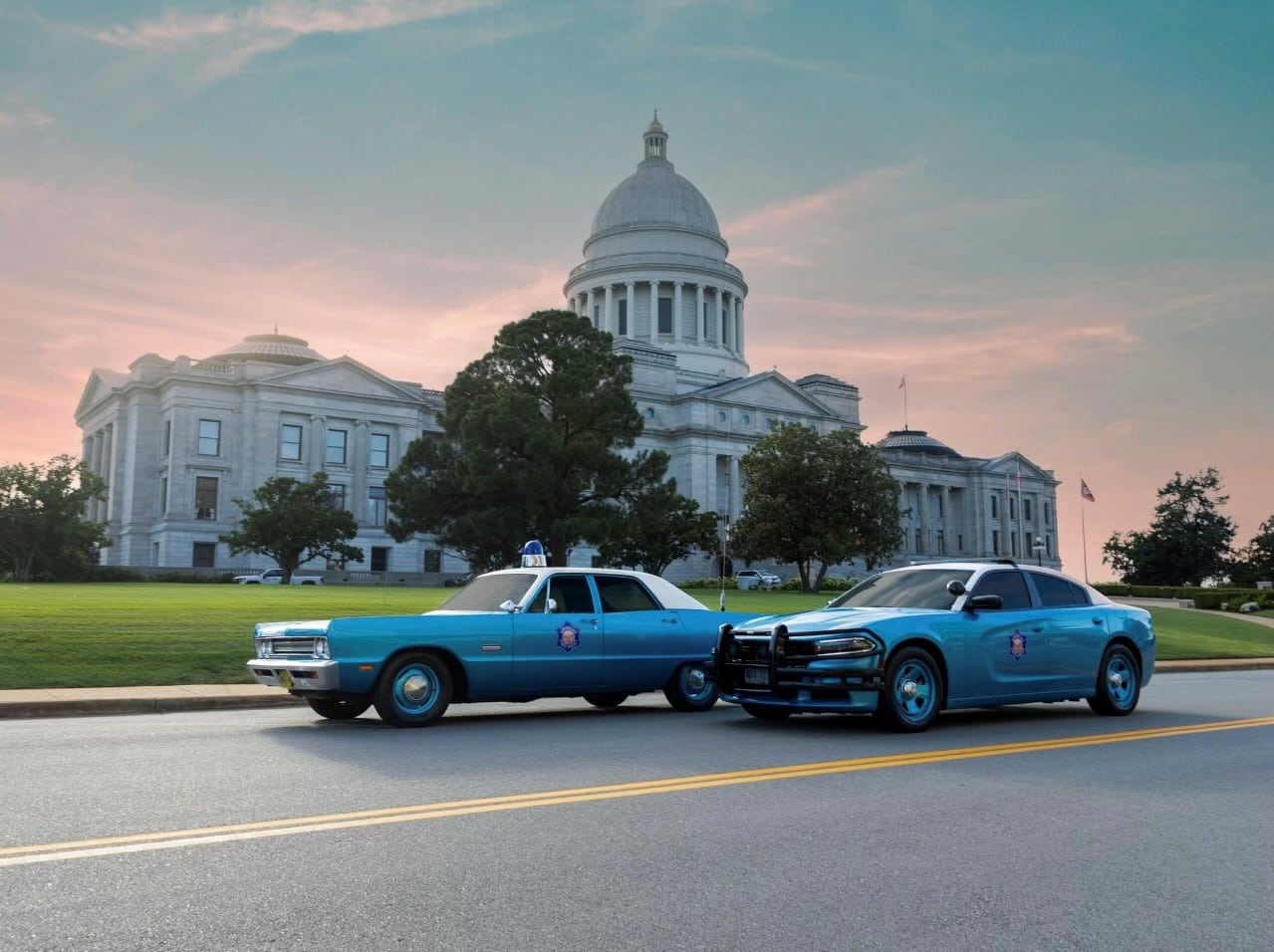 Retro police cars in front of Arkansas State Capitol
